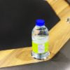 Cup holder with water bottle on poker table